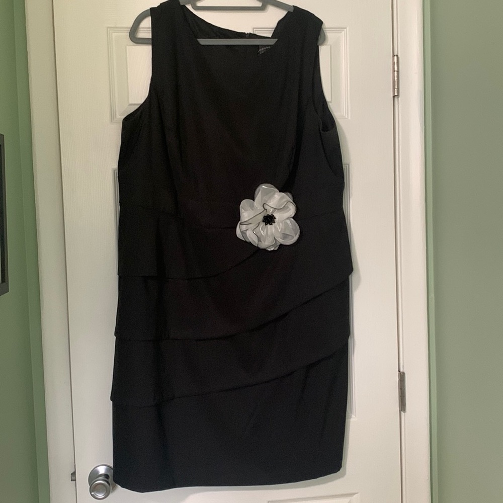 Black cocktail dress with white flower